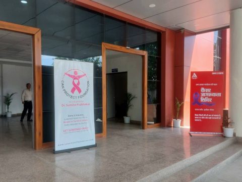 Breast cancer awareness banners at Doon Medical College auditorium
